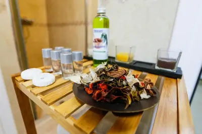 a plate of food on a table with a bottle of wine at Twin House in Ognyanovo