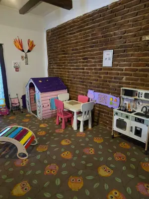 a toy kitchen with a table and a stove at Valentina Castle in Ognyanovo
