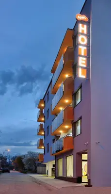 a tall building with lights on the side of it at Hotel Hello Hissar in Hisarya