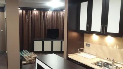 a kitchen with a sink and a tv in it at Studio Mountain Dreams Deluxe in Sapareva Banya
