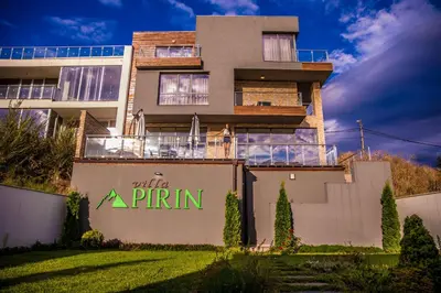 a building with a sign that reads with a spin at Villa Pirin in Simitli