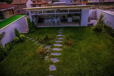 a garden with stepping stones in the yard at Villa Pirin in Simitli