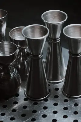 a group of silver candlesticks sitting on a table at Boutique Guest House Coco in Plovdiv