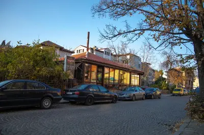 a group of cars parked on the side of a street at Old Town Apartment in Plovdiv