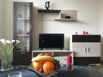 a bowl of fruit on a table in a living room at Oscar Wilde Apartment in Sofia