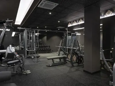 a gym with treadmills and machines in a room at Premier Luxury Mountain Resort in Bansko