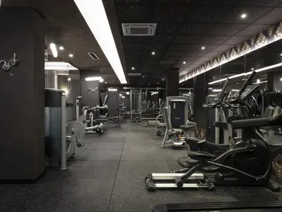 a gym with several treadmills and exercise bikes at Premier Luxury Mountain Resort in Bansko
