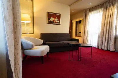 a living room with a couch and a chair at Famous House in Plovdiv