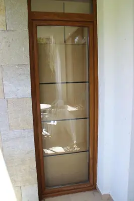 an empty glass cabinet in a wall at PM Services Semiramida Apartments in Borovets