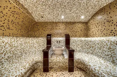 a tiled bathroom with a bowl in the middle at Ema Hotel Bansko in Bansko