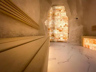 a room with a stone wall and a stone floor at Perelik Hotel in Pamporovo