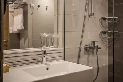 a bathroom with a sink and a shower at Rila Hotel Borovets in Borovets