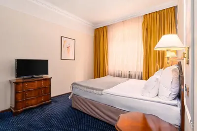 a hotel room with a bed and a television at Festa Winter Palace Hotel in Borovets