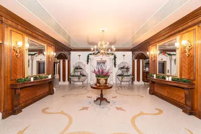 a large room with two sinks and mirrors at Festa Winter Palace Hotel in Borovets