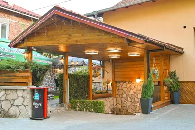a building with awning on the side of it at Hotel Rothmans-Breakfast - Free parking - Lobby in Bansko