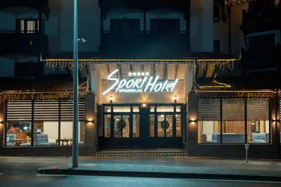 a store front at night with a sign on it at MPM Hotel Sport Ski-in, Ski-out in Bansko