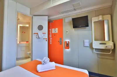 a hospital room with a bed with a towel at easyHotel Sofia in Sofia