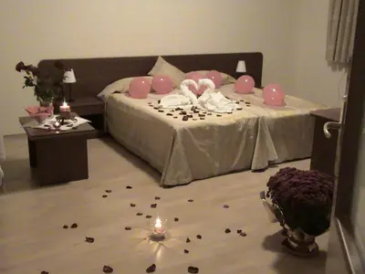 a bedroom with a bed with a lot of debris on the floor at Persey Flora Apartments in Borovets