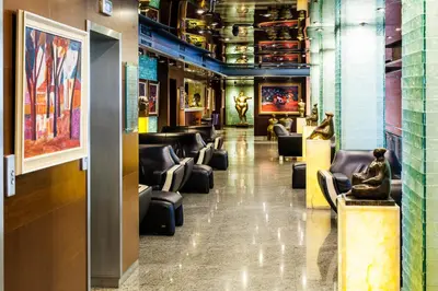 a lobby with couches and chairs in a building at Hotel Anel in Sofia