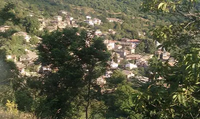 a village on the side of a mountain at Кюповата къща 1860 Qpova house in Kovachevitsa