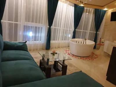 a living room with a couch and a bath tub at Safi in Dospat