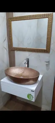 a bathroom sink with a mirror on a counter at Safi in Dospat