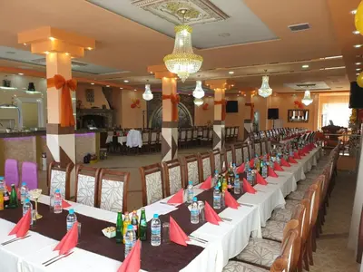a long table with bottles on it in a room at Safi in Dospat