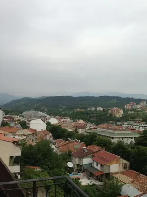 a view of a city with buildings and trees at Apartments Hristovi in Sandanski