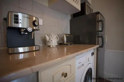 a kitchen with a counter top with a microwave at Presidency House Self Check-in Apartments in Sofia