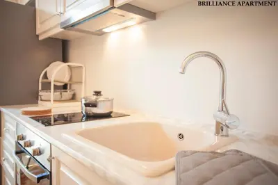a kitchen with a sink and a counter top at Presidency House Self Check-in Apartments in Sofia