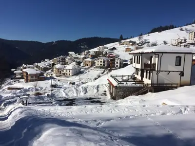 a town covered in snow with houses at Villa O Sole Mio in Progled