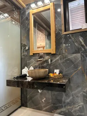 a bathroom with a sink and a mirror at V Chalet Residence in Velingrad