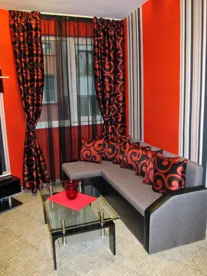 a living room with a couch and a table at Apartments Vasil Levski in Plovdiv