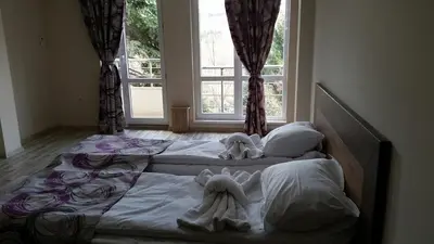 a bedroom with two beds with stuffed animals on them at Park View Studios in Sandanski