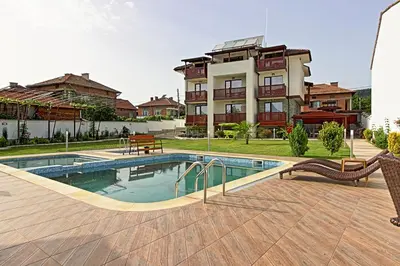 a house with a swimming pool in front of a building at White House in Ognyanovo