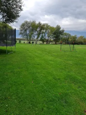 an open field with two nets in the grass at Guesthouse Green Fields in Garmen