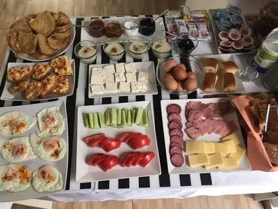 a table filled with lots of different types of food at Sveti Nikola Family Hotel Sapareva Banya in Sapareva Banya