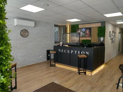 a reception area in a office with a reception desk at Apart Hotel Rosen in Sofia