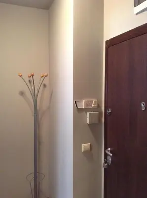 a room with a door and a vase with a plant at Apartment Sredetz in Sofia