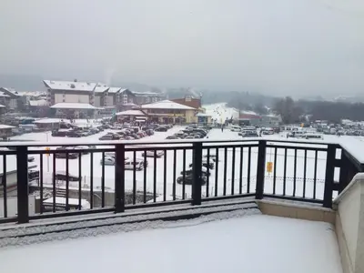 a view of a parking lot covered in snow at Mountain Paradise 4 Apartments in Bansko