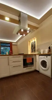 a kitchen with a washing machine and a washer at Embassy Apartment in Sofia
