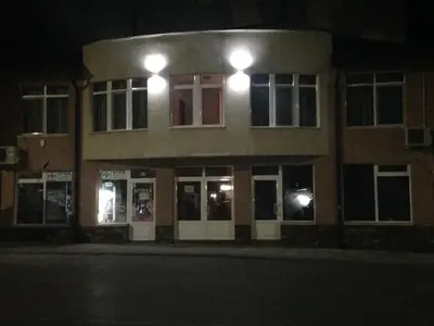 a building at night with lights in front of it at Center Guest House in Sapareva Banya