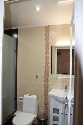 a bathroom with a toilet and a sink at Center Guest House in Sapareva Banya