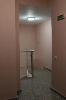 an empty room with a table in the corner at Center Guest House in Sapareva Banya