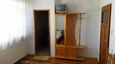 a room with a cabinet with a tv on top of it at Tsvetkovi Guest House in Dobrinishte