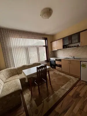 a living room with a couch and a table at Panorama Guest House in Smolyan