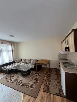 a living room with a couch and a table at Panorama Guest House in Smolyan