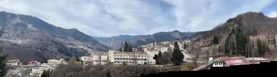 a view of a town in the mountains at Panorama Guest House in Smolyan