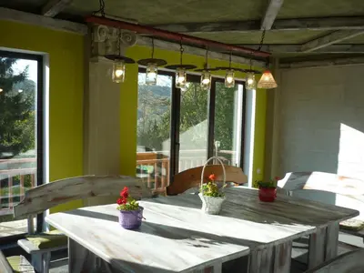 a table with potted plants sitting on a patio at Villa AdiArt in Arda