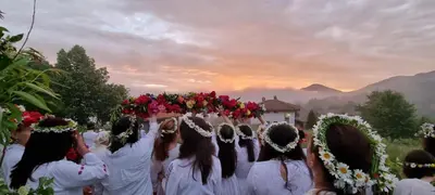 a group of women in white dresses walking down a street at Villa AdiArt in Arda